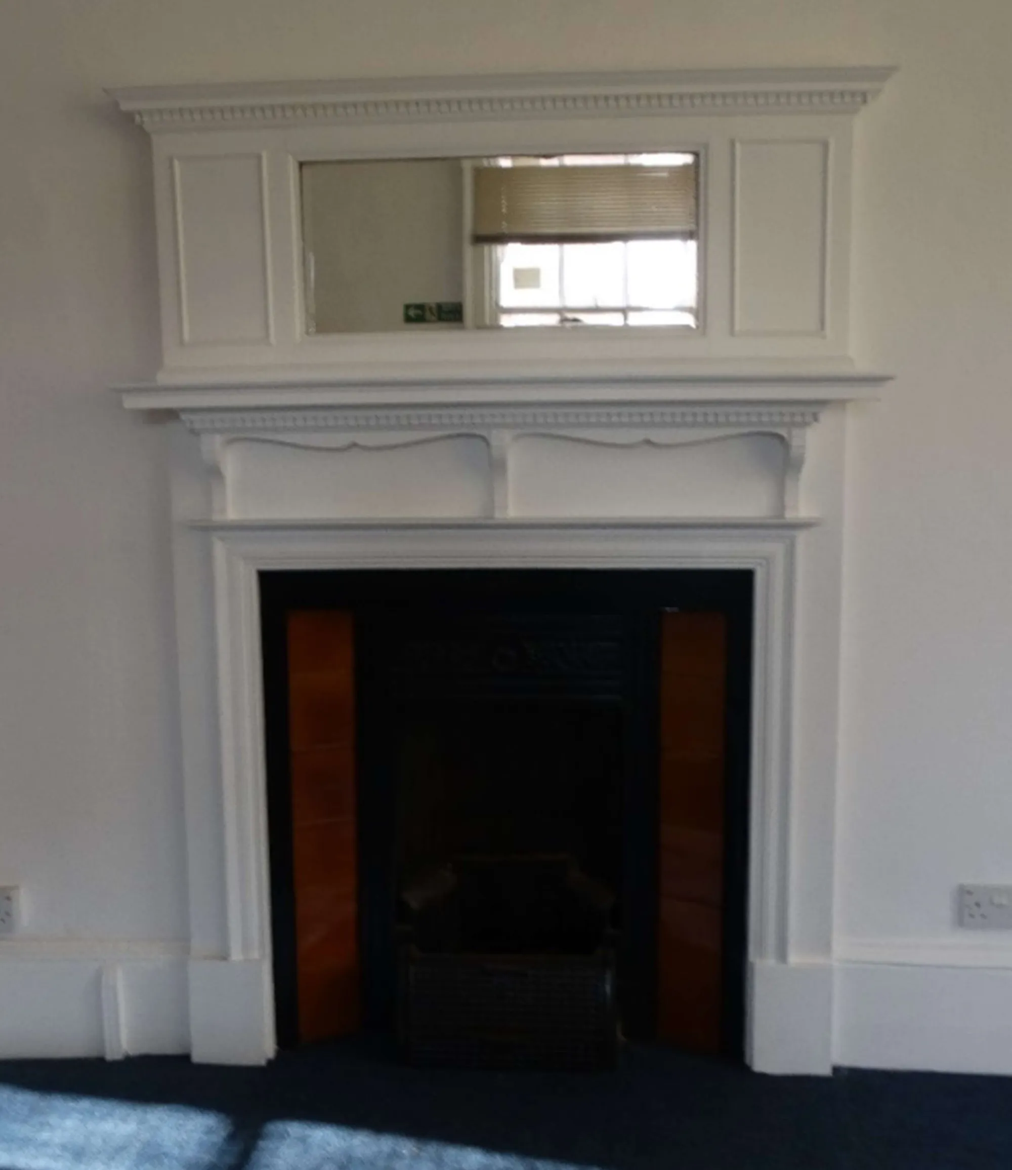 Edwardian fireplace with console shelf and mirrored overmantel
