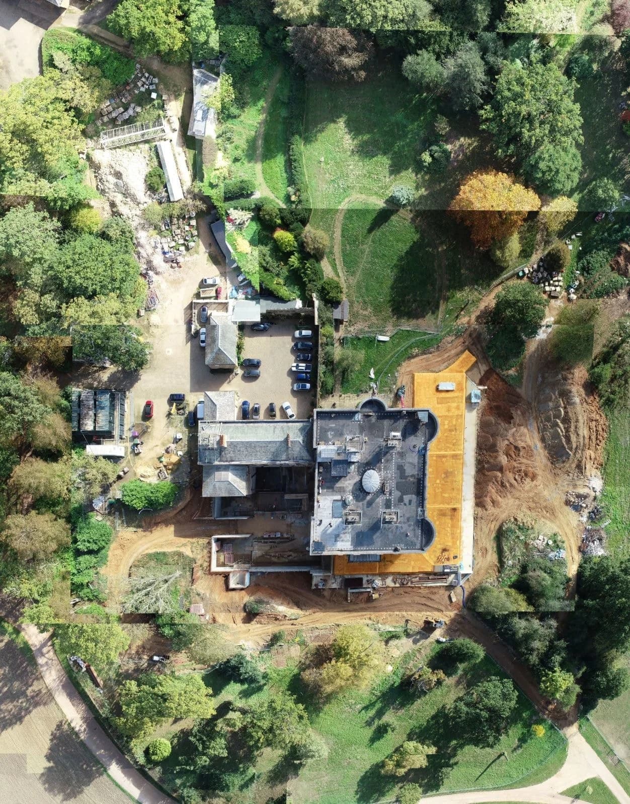 Overhead photograph showing Sacombe House, surrounding trees and areas of construction